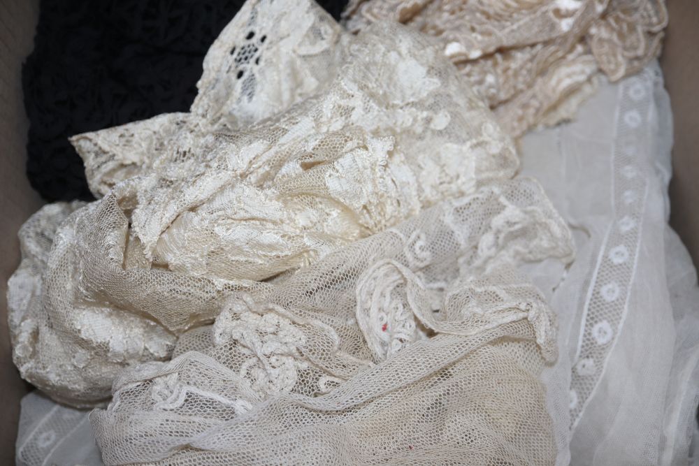 An Edwardian ladies lace blouse, a black bobbin lace shawl, a cream silk machine lace shawl and mixed trimmings